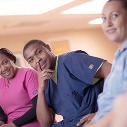 Smiling healthcare workers in scrubs