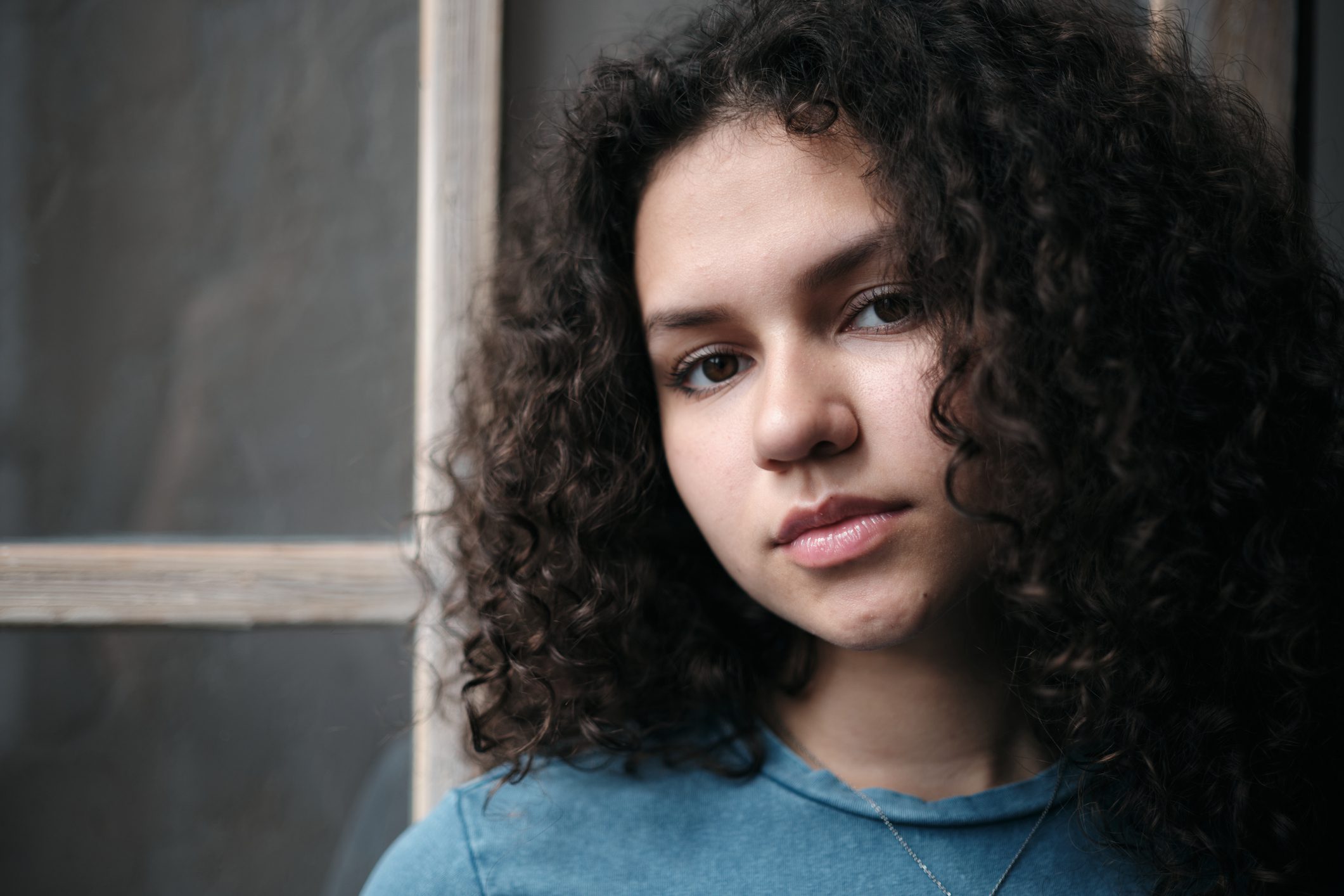 Teen girl looking out,