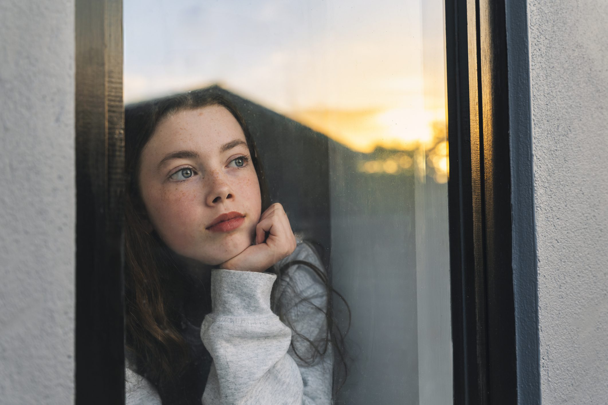 Girl looking out the window.