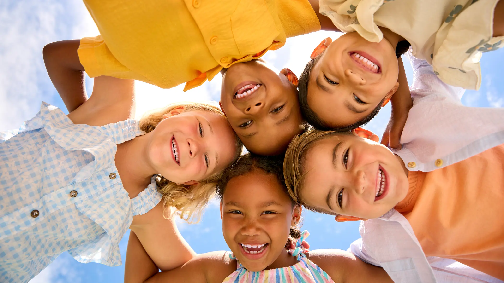 children smiling together in a circle